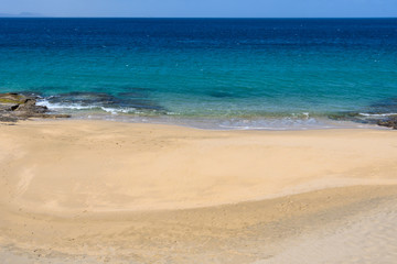 Fototapeta na wymiar Secluded beach in the Papagayo Coast in Lanzarote, Spain