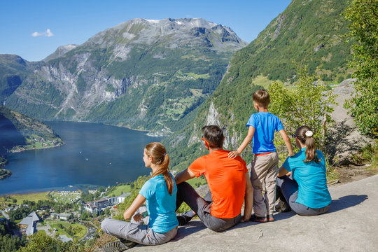 Family with children above Geiranger Fjord.