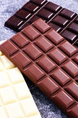 chocolate in diffrent color. milk, dark and white chocolate bars