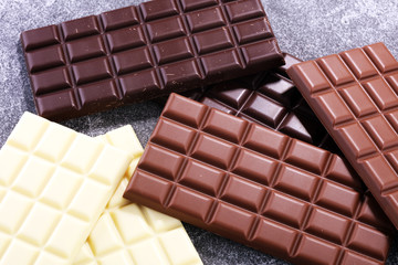 chocolate in diffrent color. milk, dark and white chocolate bars