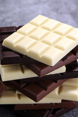 chocolate in diffrent color. milk, dark and white chocolate bars