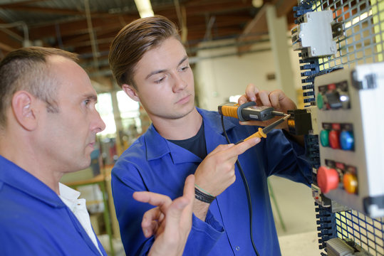 Electrician training male apprentice