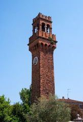 Fototapeta na wymiar The medieval bell tower, or campanile, of San Stefano church, Murano, Venice