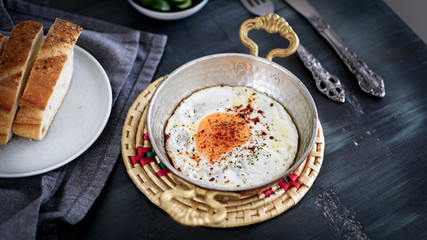 fried egg in the copper frying pan