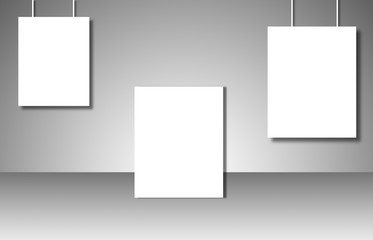 Empty white posters on gray background