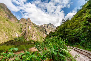 Fototapeta na wymiar Railroad tracks to Machu Picchu along the Vilcanota River (Urubamba) in Peru