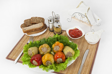Bulgarian pepper stuffed with meat with herbs sauce and sour cream. A fine meal for lunch.