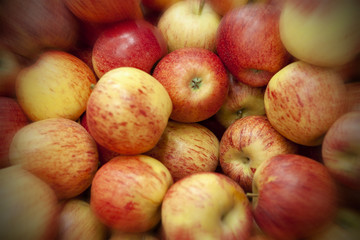 Fresh apples spread out an even layer as a background.