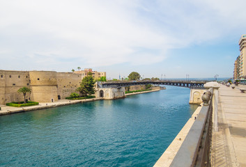 Fototapeta na wymiar Taranto (Italy) - The historic center of a big city in southern Italy, Puglia region, on the sea with industry port, in a spring day.
