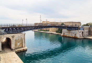 Fototapeta premium Taranto (Italy) - The historic center of a big city in southern Italy, Puglia region, on the sea with industry port, in a spring day.
