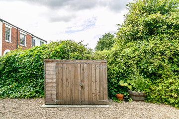 Wooden shed in a typical English garden