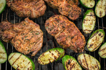 Top view of fresh meat and vegetable on grill. Barbecue on grill