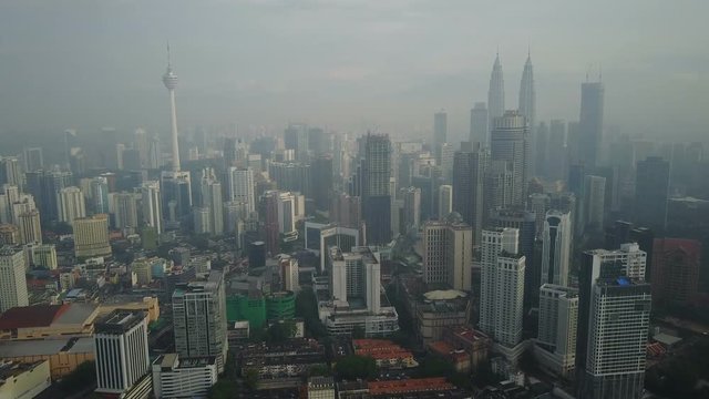 Flying towards Kuala Lumpur city center in early morning