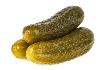 Close up of pickled cucumbers on a white background