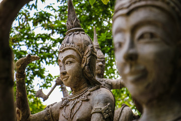 Ancient stone statues in Secret Buddhism Magic Garden, Koh Samui, Thailand. A place for relaxation and meditation.