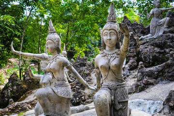 Ancient stone statues in Secret Buddhism Magic Garden, Koh Samui, Thailand. A place for relaxation and meditation.