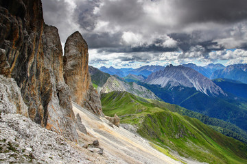 Elevated view of Karnischer Hohenweg path on grassy Alpi Carniche Karnische Alpen main ridge under rock faces of Cavallino Kinigat peak, Italian Austrian border Belluno Veneto Osttirol Europe