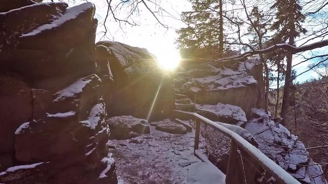 Walking path between heavy stones in Harz Germany to viewing point over forest