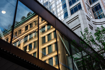 Close cropped image of building's reflection in skywalk window