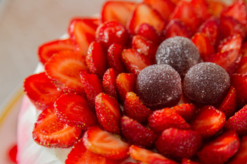 Bright beautiful mouth-watering strawberry cake and cream.