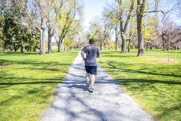Runner on sunny day in the park