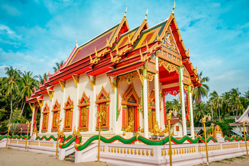 Fototapeta premium Traditional decorated Thai Buddhism temple during a bright sunny day with blue sky, Wat Plai Laem Temple in Koh Samui, Surat Thani, Thailand