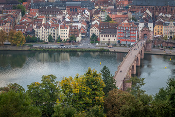 Fototapeta na wymiar Old Bridge and Old town in Heidelberg with tourists and river Necker