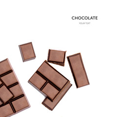 Dark chocolate pieces isolated on white background. Top view