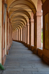 Many arches in an arcade in Europe with a shallow depth of field and copy space