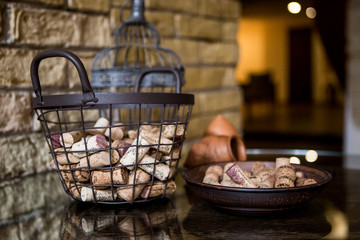 Metal basket made of wire,  filled with wine cork