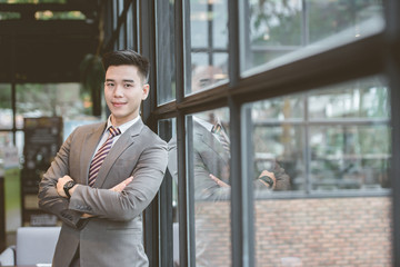 Handsome smiling confident businessman portrait