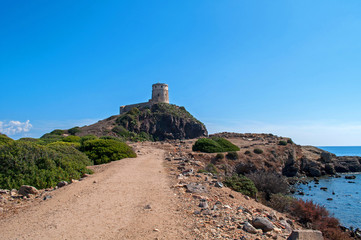 Fototapeta premium Old Genoa Tower above the sea in Sardinia