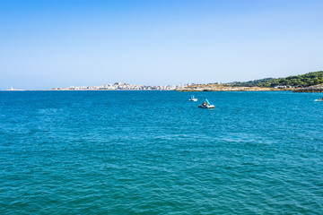 Summer seascape with the town of Vieste on the background, Gargano peninsula, Apulia, Italy