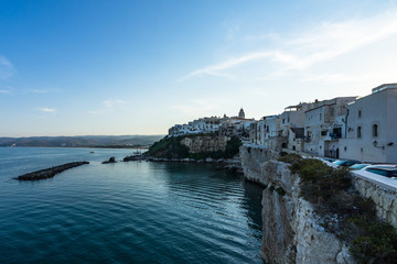 Fototapeta na wymiar Seascape with the historic centre of Vieste, a famous seaside town for summer holidays, Gargano, Apulia, Italy