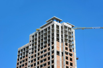 Crane and highrise construction site