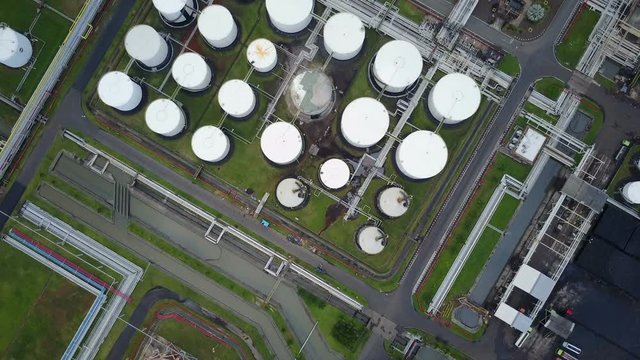 Overhead drone shot of storage depot tanks of major oil refinery in central Java, Indonesia