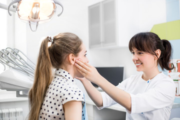 Obraz na płótnie Canvas Dentist Checks the Oral Cavity of the Patient in the Dental Clinic