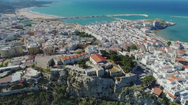 Polignano a Mare Apulia City Sea Coastline white houses ana castle in Italy Drone flight