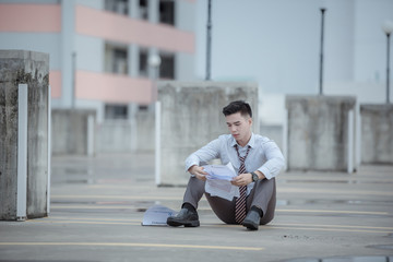 Unemployed businessman stress sitting on stair,