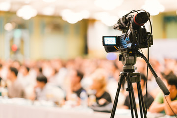 Video camera set record audience in conference hall seminar event. Company meeting, exhibition...
