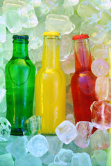Colorful cold soda drinks, filled ice cubes in a coolbox