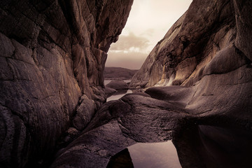 A sea shore cave with walls polished by tides