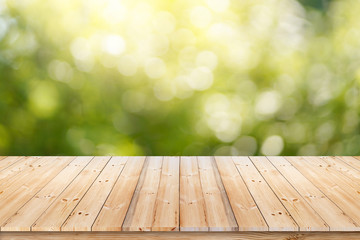 Abstract spring or summer with sunlight background and wood table.