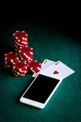 Smartphone with two ACEs in poker and casino chips