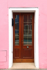 Pink facade retro entrance door