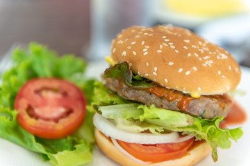 Close up layers of hamburger with vegetable.