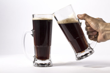 glass of dark beer isolated on white background