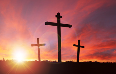 Cross Signifying Crucifixion of Jesus With Sunset Sky and Copy Space. Concept of Christianity and Good Friday or Easter Sunday.