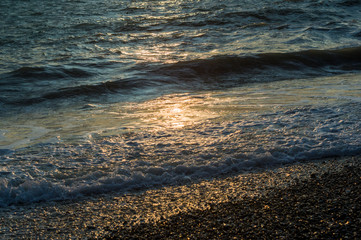 Amazing sea sunset, the sun, waves, clouds