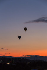 Hot air balloon takes off at sunrise